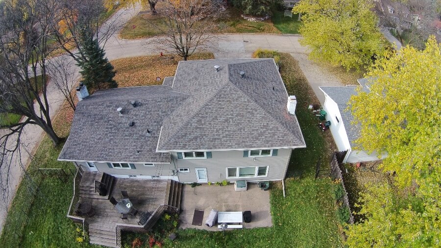 A completed gray architectural-shingle roof on a Twin Cities home.